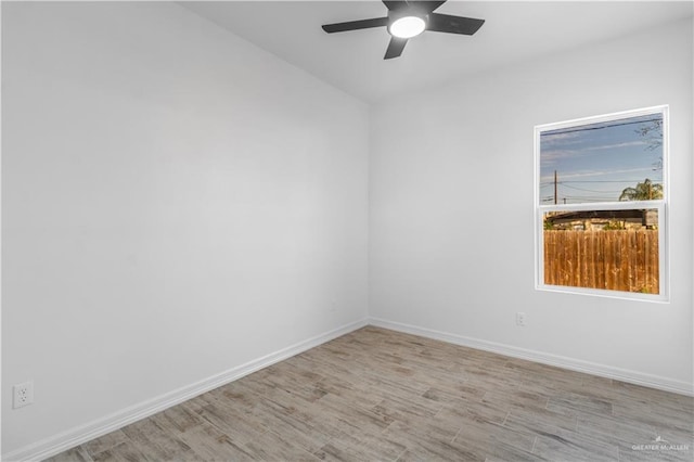 unfurnished room featuring ceiling fan and light hardwood / wood-style floors