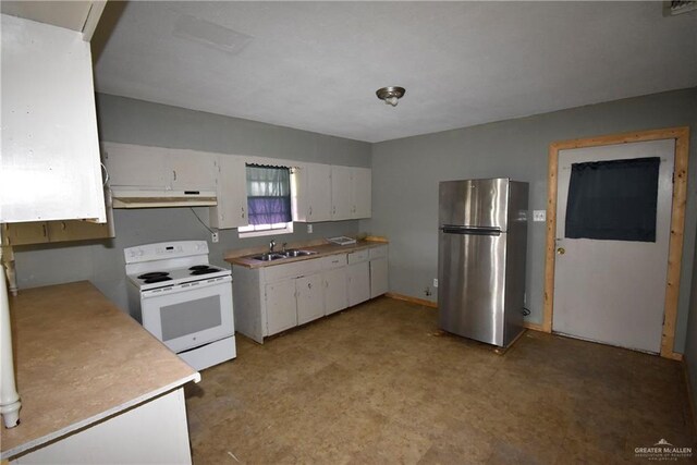 kitchen featuring white electric range oven, freestanding refrigerator, a sink, under cabinet range hood, and white cabinetry