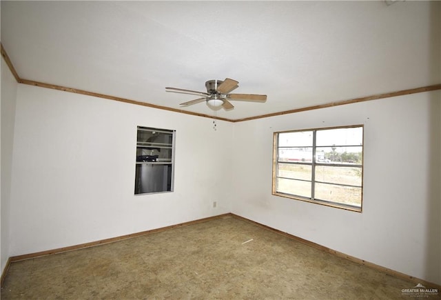 empty room with baseboards, ceiling fan, and crown molding