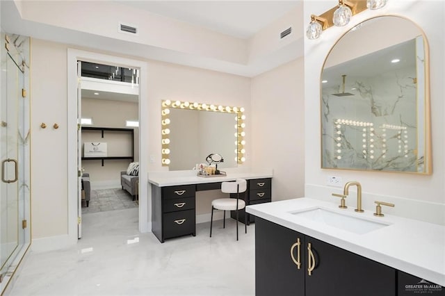 bathroom with a shower with door and vanity