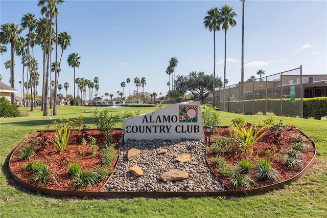community sign with a yard and a residential view
