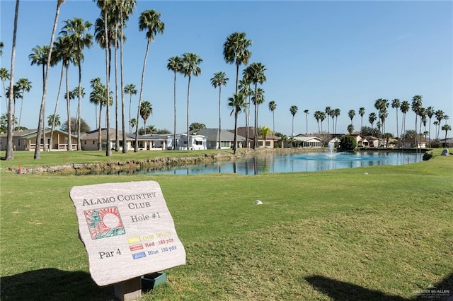 surrounding community with a yard, a residential view, and a water view