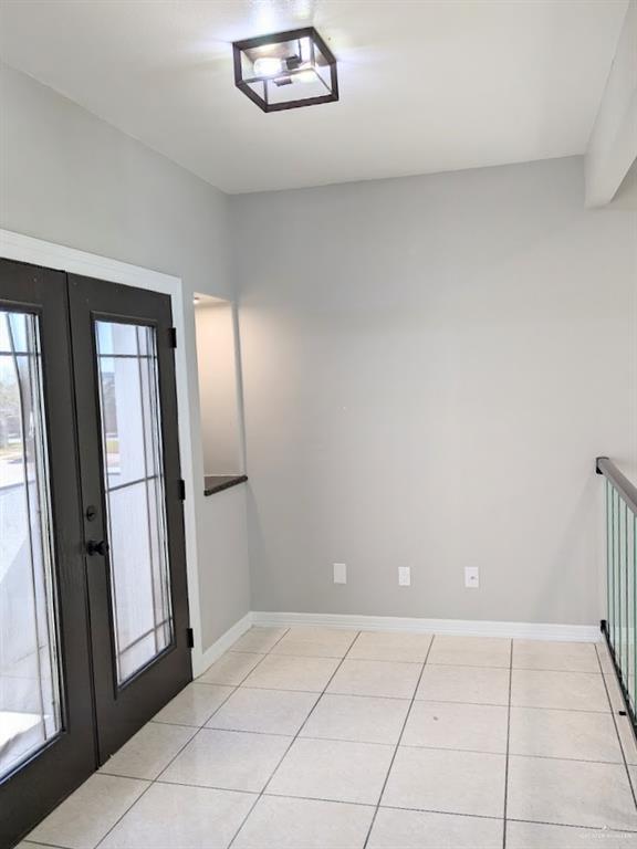 tiled foyer entrance with french doors