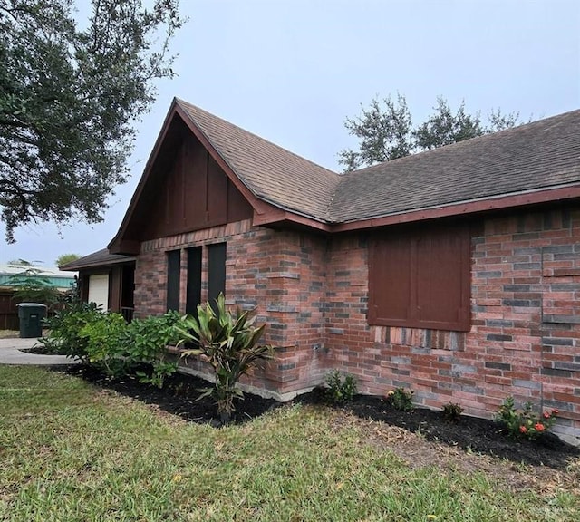 view of home's exterior with a yard