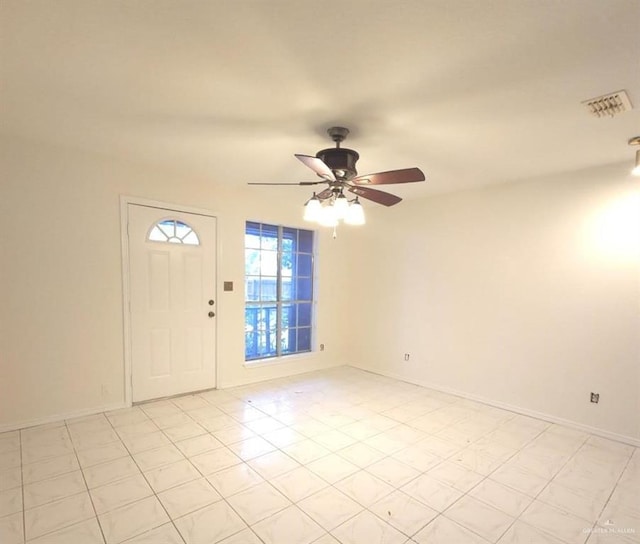 entrance foyer with ceiling fan