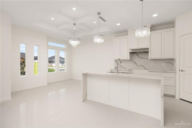 2012 Trinity St, Donna, TX 78537 - kitchen featuring a sink, recessed lighting, backsplash, coffered ceiling, and a notable chandelier