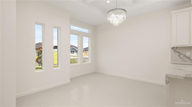 2012 Trinity St, Donna, TX 78537 - unfurnished dining area featuring an inviting chandelier, light tile patterned floors, and baseboards