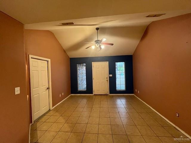 tiled foyer featuring vaulted ceiling and ceiling fan