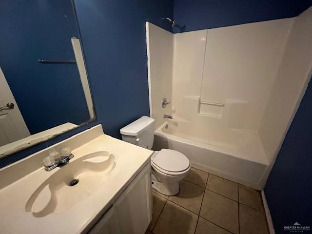 full bathroom with tile patterned flooring, vanity, toilet, and washtub / shower combination