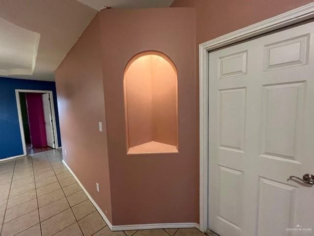 corridor featuring light tile patterned flooring