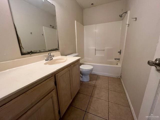 full bathroom with shower / tub combination, vanity, tile patterned floors, and toilet