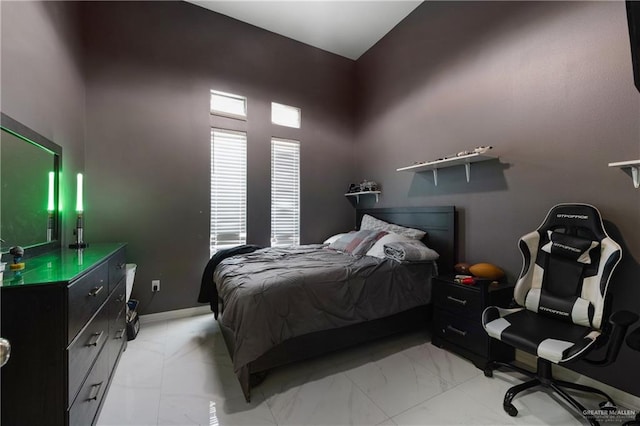 bedroom with a towering ceiling