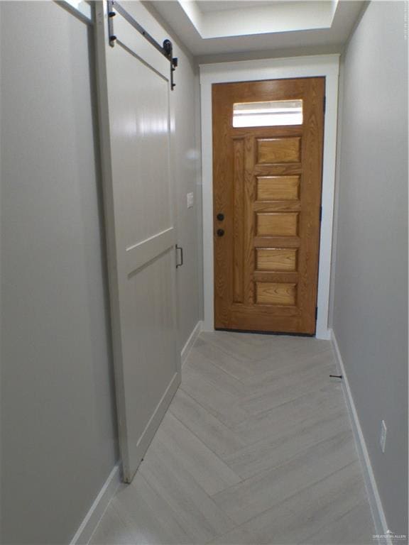 doorway to outside featuring a barn door