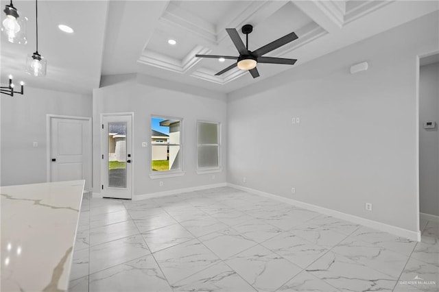 spare room with marble finish floor, coffered ceiling, and baseboards