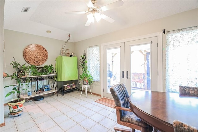 office area featuring light tile patterned floors, visible vents, a ceiling fan, a textured ceiling, and french doors