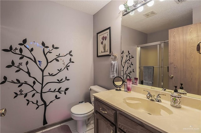 bathroom featuring a textured ceiling, toilet, visible vents, vanity, and a stall shower