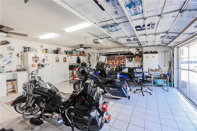 garage featuring a garage door opener and ceiling fan