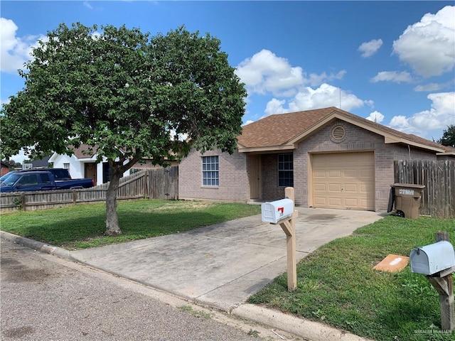 view of front facade with a garage and a front yard