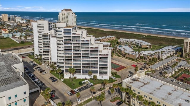 birds eye view of property featuring a water view and a view of the beach