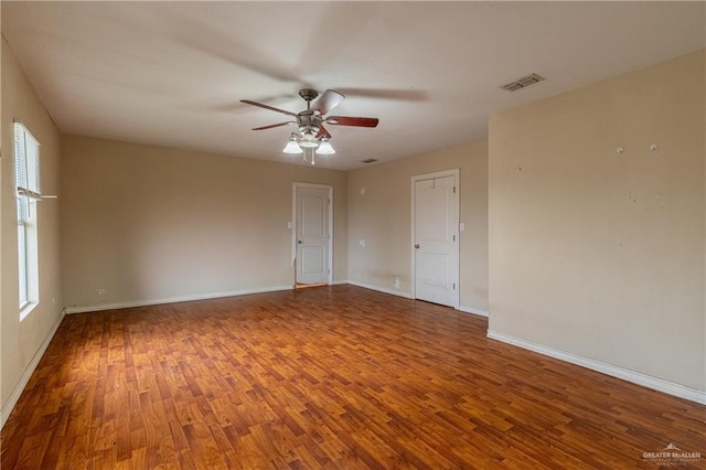 unfurnished room with ceiling fan and wood-type flooring