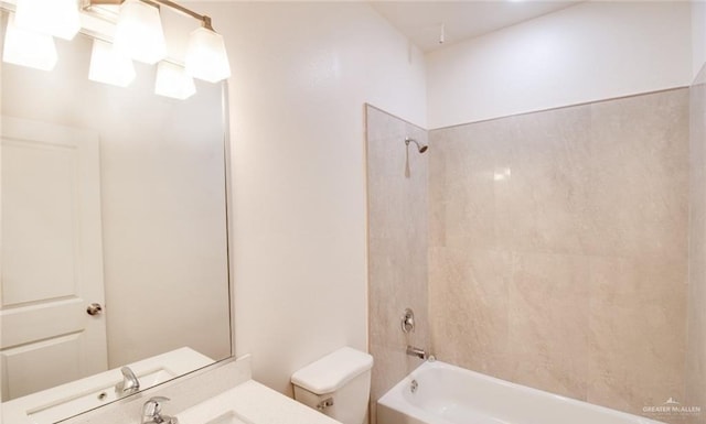 full bathroom featuring vanity, toilet, and tiled shower / bath