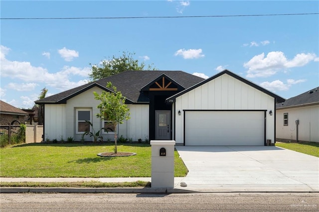 modern inspired farmhouse with fence, an attached garage, board and batten siding, driveway, and a front yard