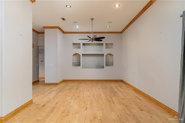 unfurnished room featuring light wood-type flooring, ceiling fan, and crown molding