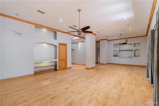 unfurnished living room with ceiling fan, light wood-type flooring, and ornamental molding