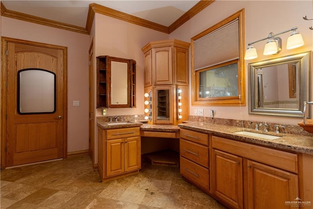 bathroom featuring crown molding and vanity