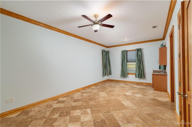 unfurnished room featuring ceiling fan and crown molding