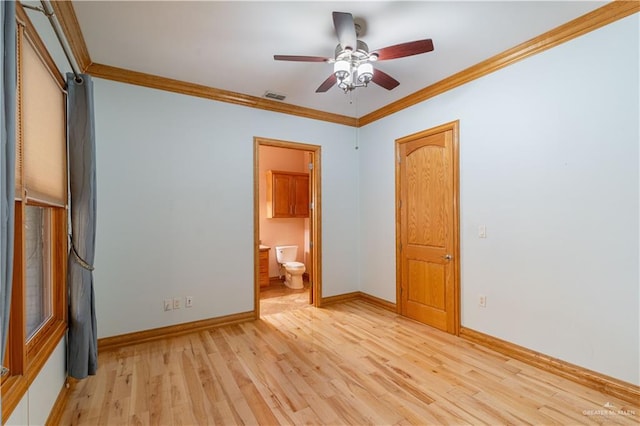 unfurnished bedroom featuring ceiling fan, ensuite bath, ornamental molding, and light hardwood / wood-style flooring