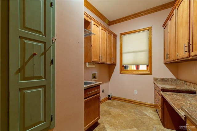 clothes washing area with cabinets, hookup for a washing machine, ornamental molding, and electric dryer hookup