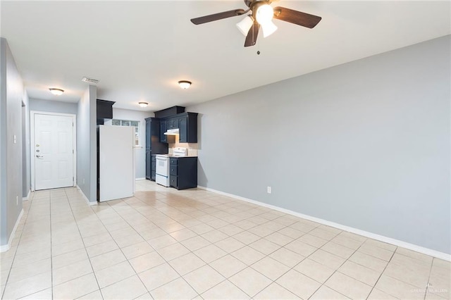 interior space with blue cabinetry, light tile patterned floors, white appliances, and ceiling fan