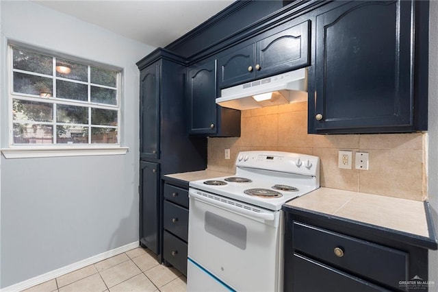 kitchen with white range with electric stovetop, light tile patterned floors, and backsplash