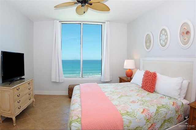 310A Padre Blvd Unit 1305, South Padre Island, TX 78597 - bedroom with baseboards and a ceiling fan