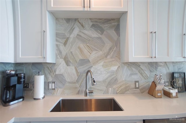310A Padre Blvd Unit 1305, South Padre Island, TX 78597 - kitchen with white cabinets, decorative backsplash, and a sink