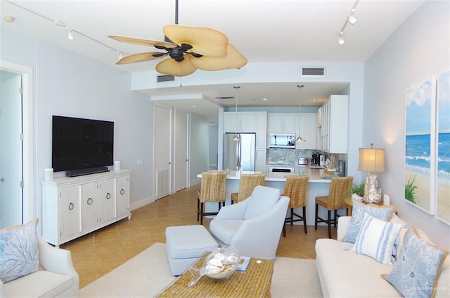 310A Padre Blvd Unit 1305, South Padre Island, TX 78597 - living area featuring track lighting, light tile patterned flooring, and a ceiling fan