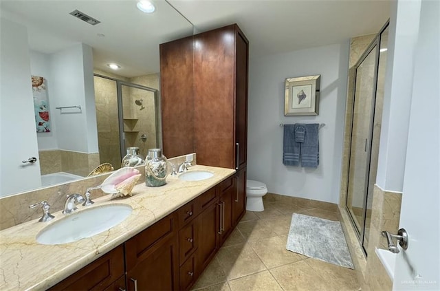 310A Padre Blvd Unit 1305, South Padre Island, TX 78597 - bathroom with a stall shower, tile patterned floors, toilet, a garden tub, and double vanity