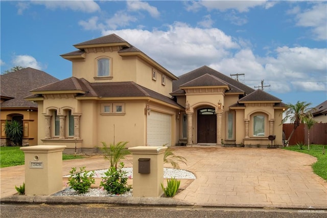 mediterranean / spanish-style home featuring a garage