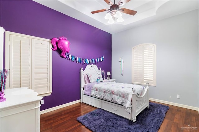 bedroom featuring ceiling fan and dark wood-type flooring