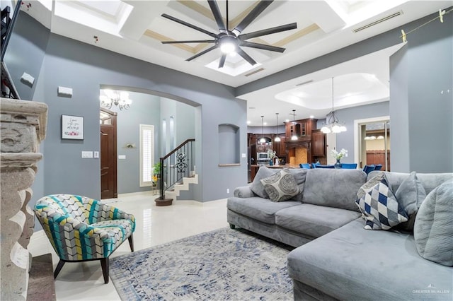 2428 Christina Ave, Mission, TX 78572 - living room with ceiling fan with notable chandelier, beam ceiling, a healthy amount of sunlight, and coffered ceiling
