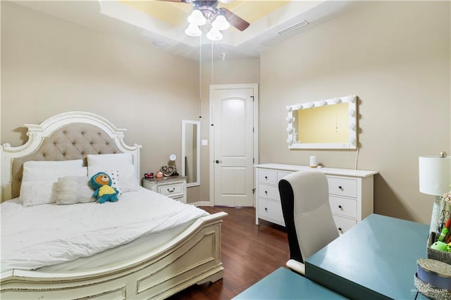 bedroom with ceiling fan and dark hardwood / wood-style flooring