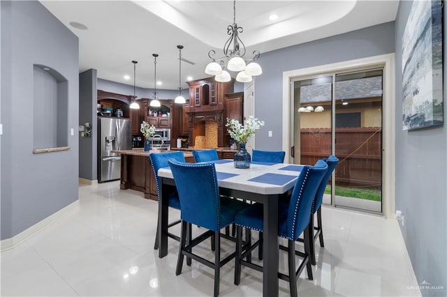 2428 Christina Ave, Mission, TX 78572 - dining area featuring a raised ceiling, light tile patterned floors, and a chandelier