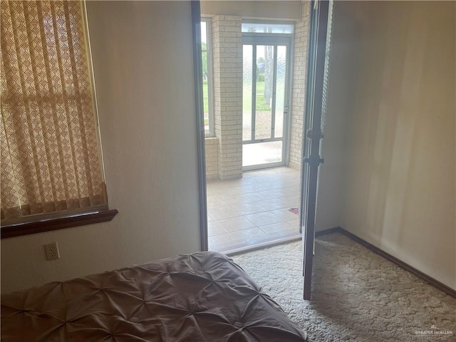 unfurnished bedroom with light colored carpet