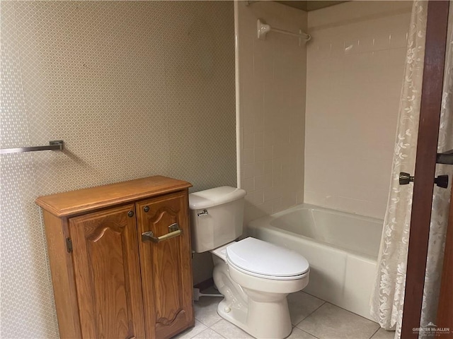 bathroom with tile patterned floors, shower / tub combo with curtain, and toilet