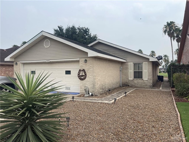 rear view of property featuring a garage