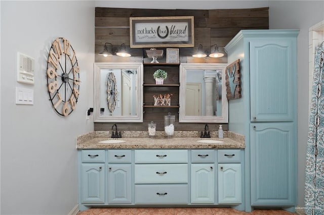 full bath with double vanity and a sink