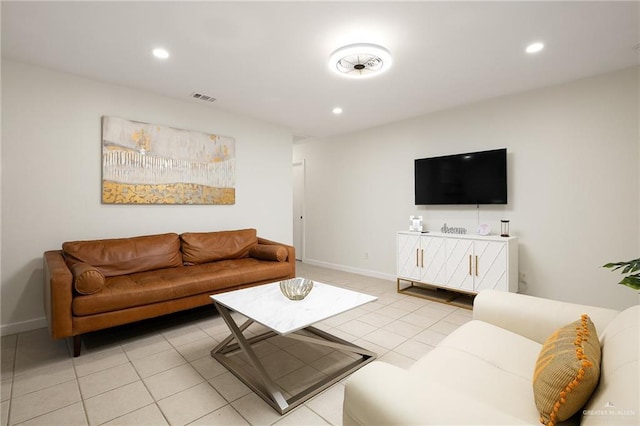 living area featuring recessed lighting, visible vents, baseboards, and light tile patterned flooring