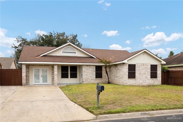 single story home with brick siding, a shingled roof, fence, french doors, and a front yard