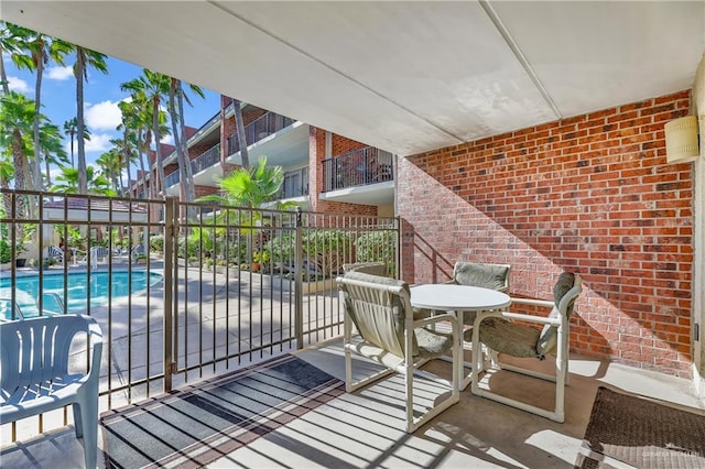 view of patio with a community pool